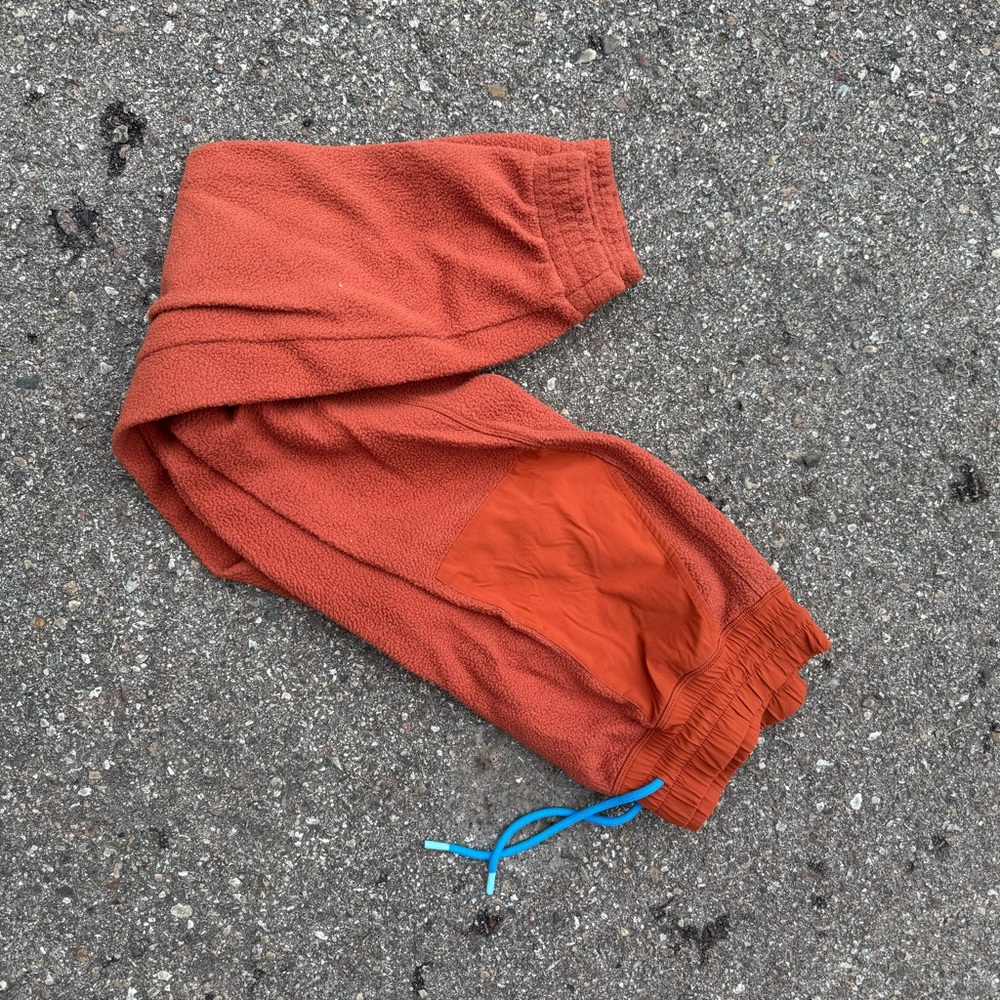 Cotopaxi Orange Joggers with Blue Drawstring